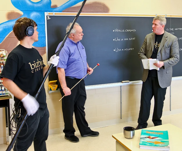 The lesson. Bob at the chalkboard with the injury statistics written up.