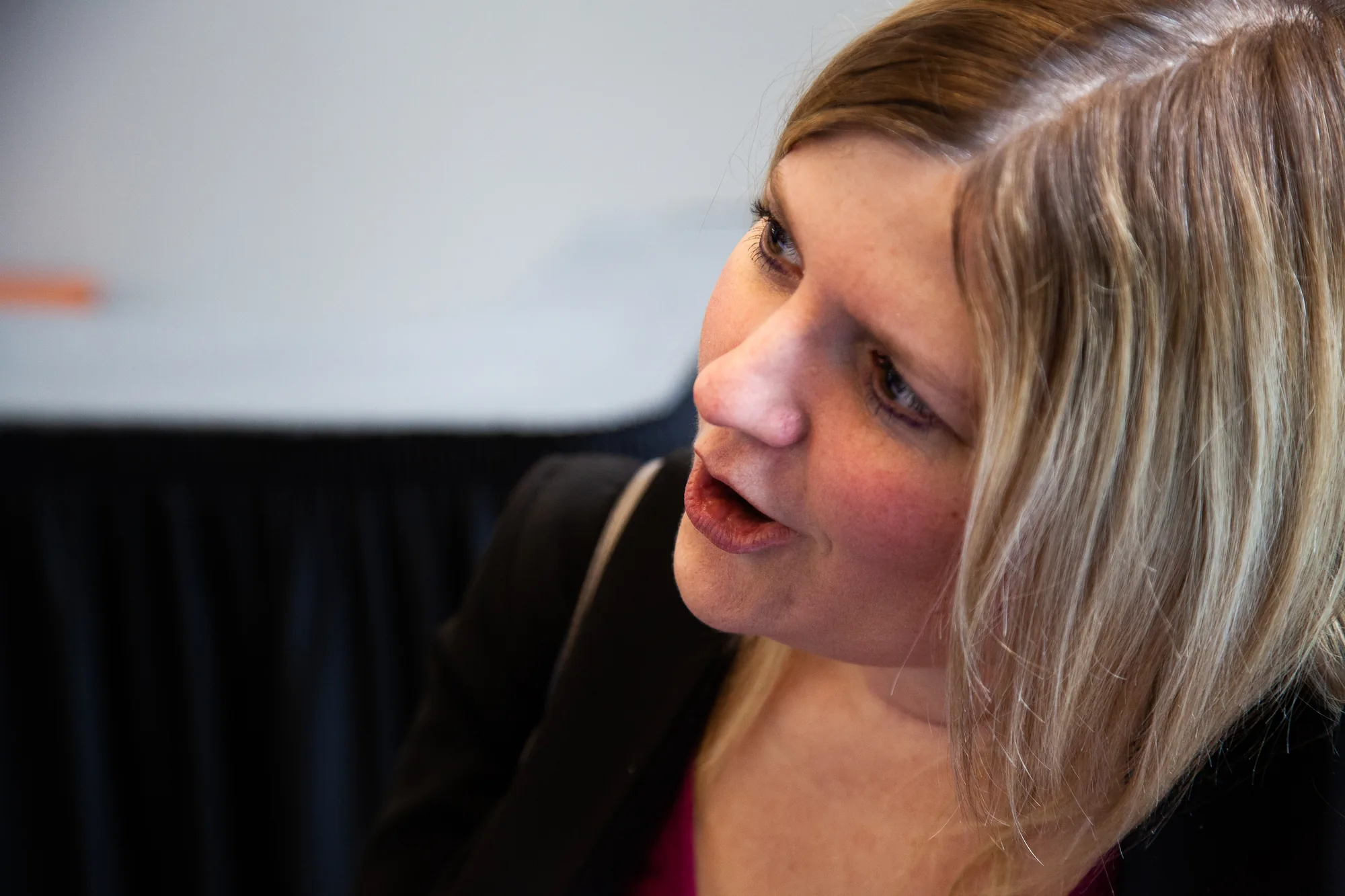 A close-up of a woman mid-sentence.